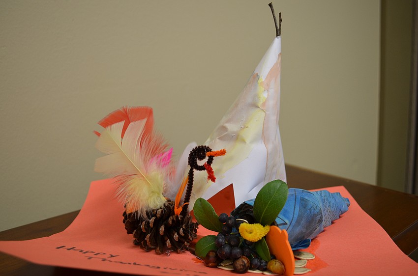 The children from the Pines of Sarasota Child Care Center made Thanksgiving-themed crafts.