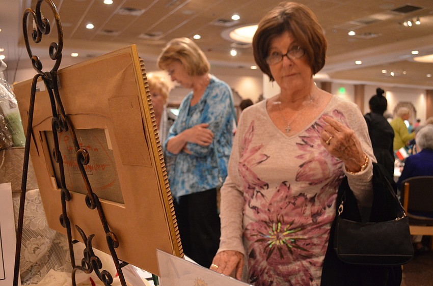 Kathy Meltebrink browses the silent auction prizes.