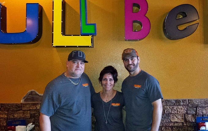 Shane, Pinki and Matt Holt are hoping to expand their business, Full Belly Stuffed Burgers.