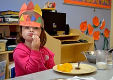 Norah Organek, enjoys a big bite of turkey.
