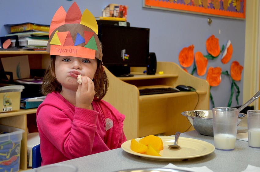 Norah Organek, enjoys a big bite of turkey.