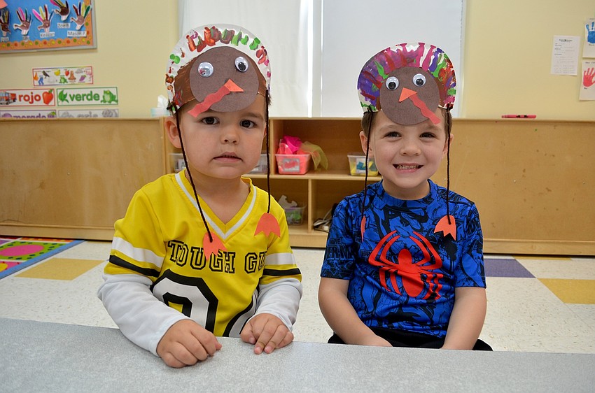 Jaxon Story and Nolan Lane show off their turkey hats.