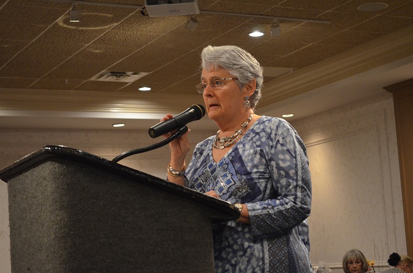 Nancy Sweeney welcomes guests to start the luncheon.