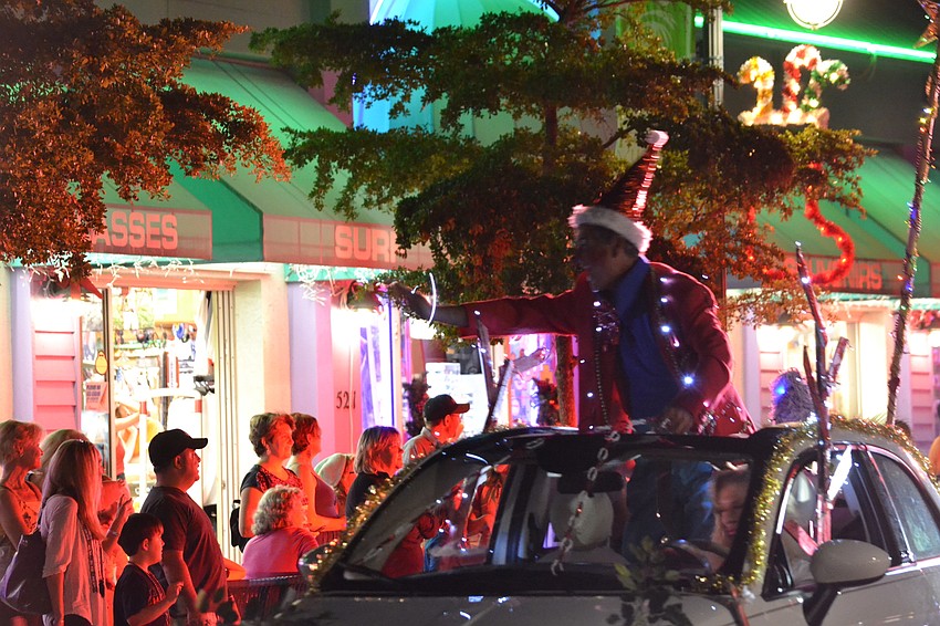 Sunshine the Clown kicks-off the parade down Ocean Boulevard in Siesta Key Village.