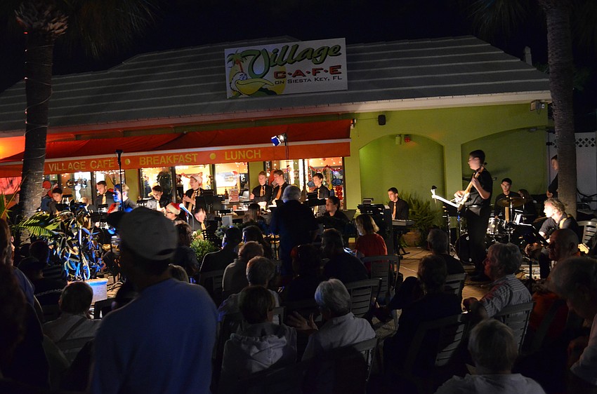 The Pine View Jazz Ensemble performs outside Village Cafe.