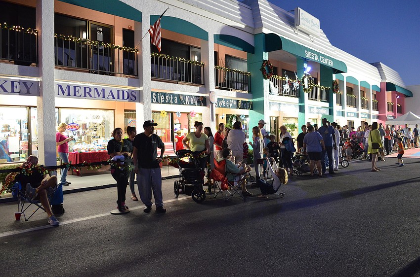 Parents and children await the arrival of Santa Claus.