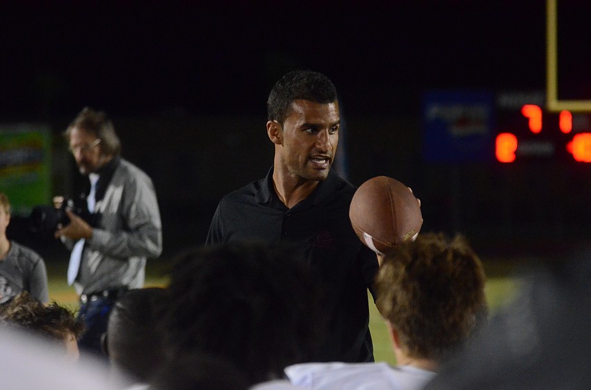 Braden River coach Curt Bradley talks to his players following the Pirates 17-7 victory against Plant City Nov. 28 (courtesy Justin Kline)