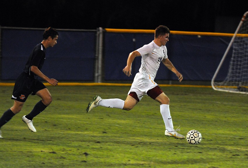 Sarasota Christian junior Jordan Schmucker pushes the ball up the field.