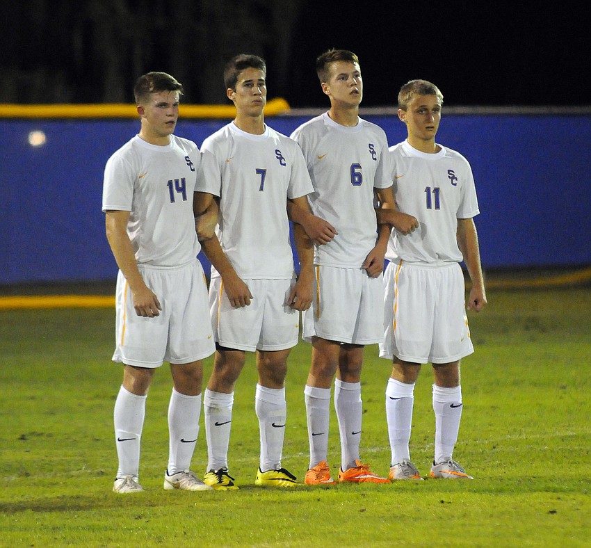Sarasota Christian's Jordan Schmucker, Tanner Stutzman, Riley Hagan and Trey Lantz prepare to defend a penalty kick in the first half.