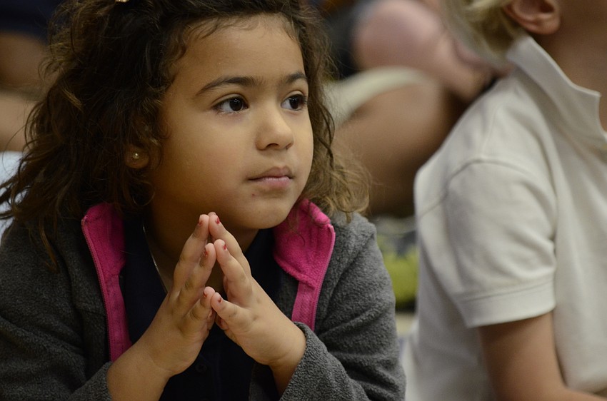 Jolie Cruze listens intently to the song.