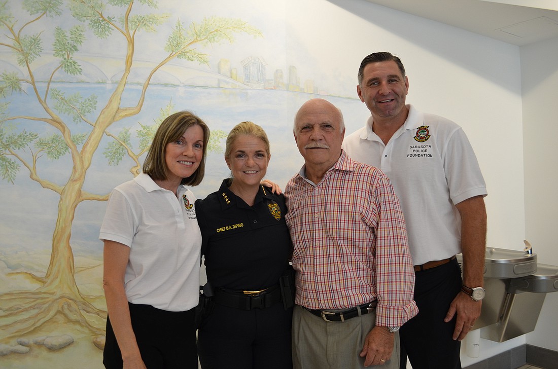 Christine Goodall, Sarasota Police Chief Bernadette DiPino, artist Joe Cuffaro and Mike Evanoff