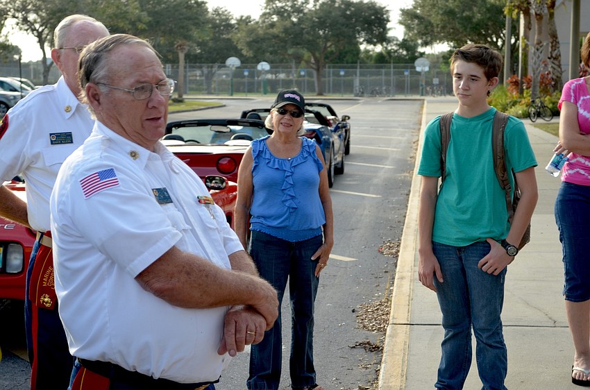 U.S. Marine Corps veteran Mike McClain speaks to students about the importance of giving.