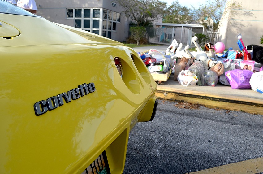 Students posed in nine Corvettes, which ranged in year and color.