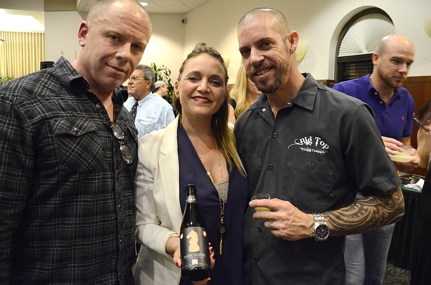 Dennis Metz with Urbani Truffles representative Sabrina Notarnicola and Big Top Brewing Co. brewmaster Josh Wilson.