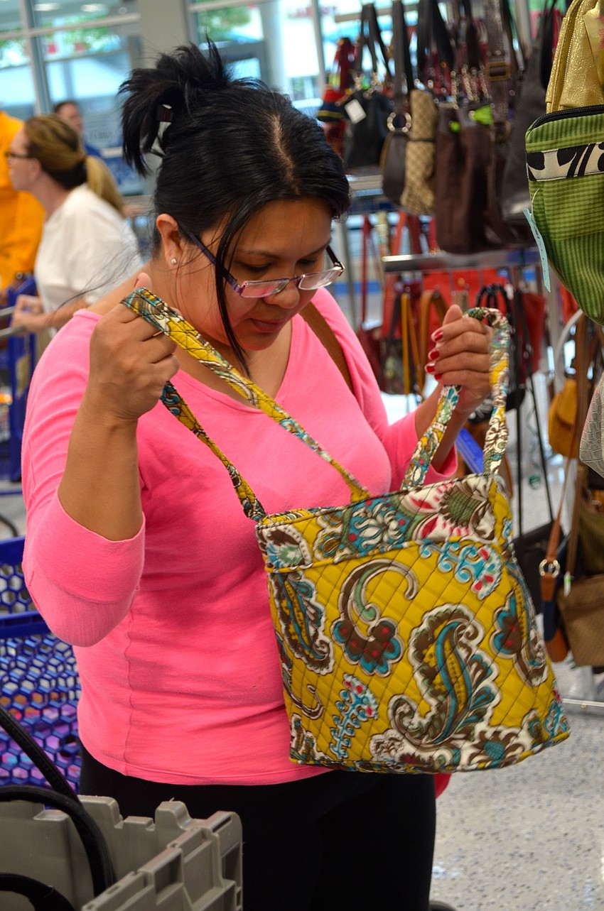 East County resident searches for new purses and backpacks for her children.