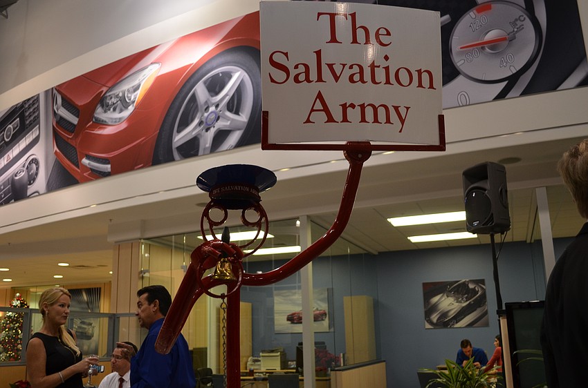 A tube dude dressed to resemble a volunteer with a kettle and bell.