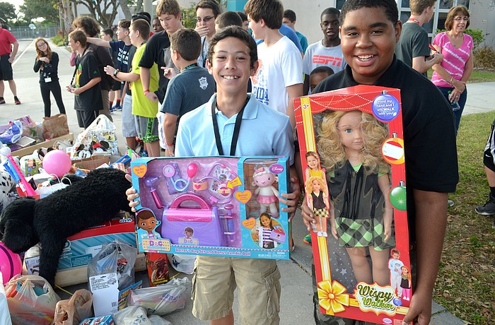 Derian Pettitt, 12, and Michael Haynes Jr., 14, donated dolls, among other toys.