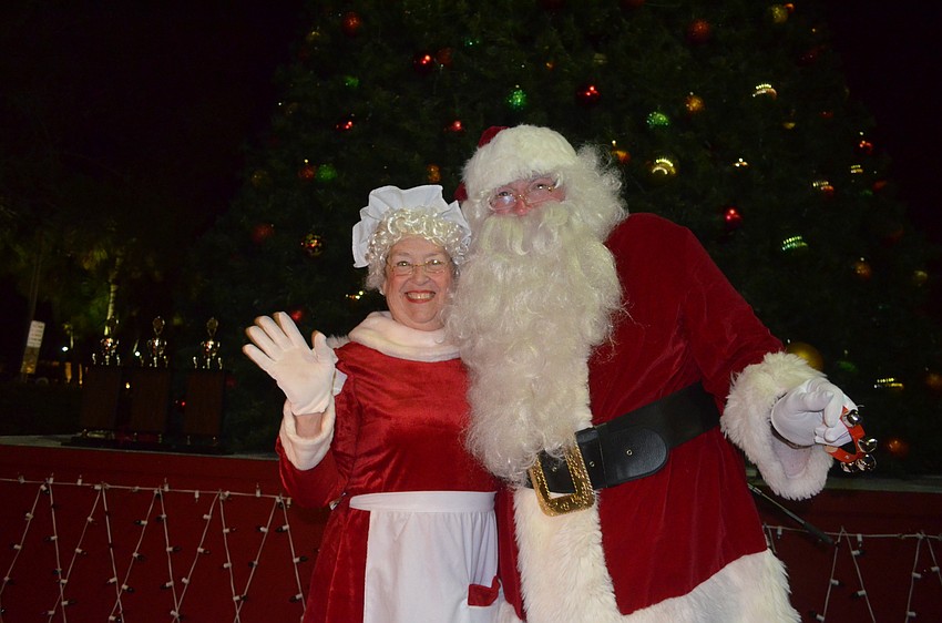 Santa and Mrs. Claus greet the crowd.