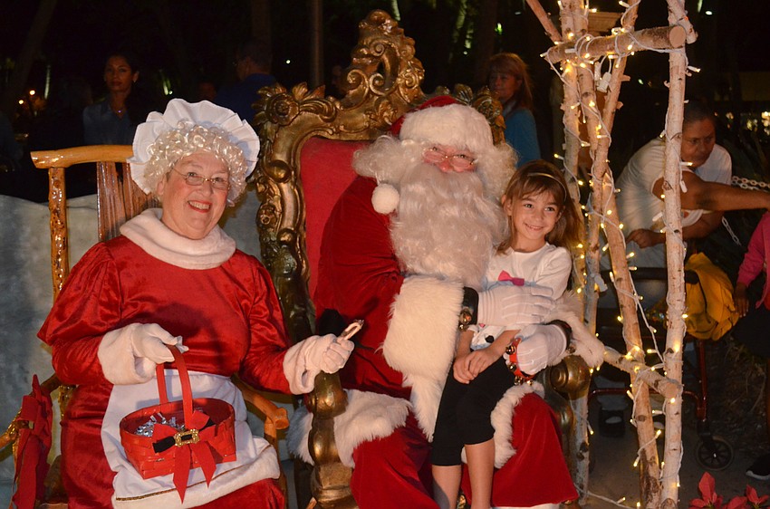 Alaina Duran, 5, with Mrs. and Santa Claus