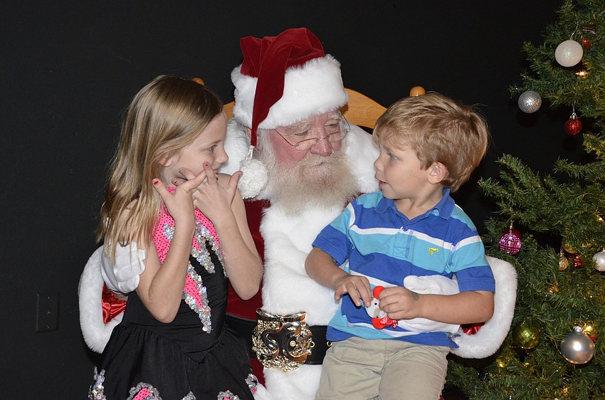 Addison and Jayce Stennett talk with Santa.