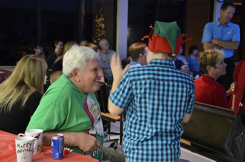 Herb Dolan talks with his grandson Jakub.