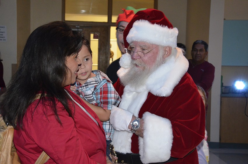 Kathy and Drew Whinery talk meet Santa.