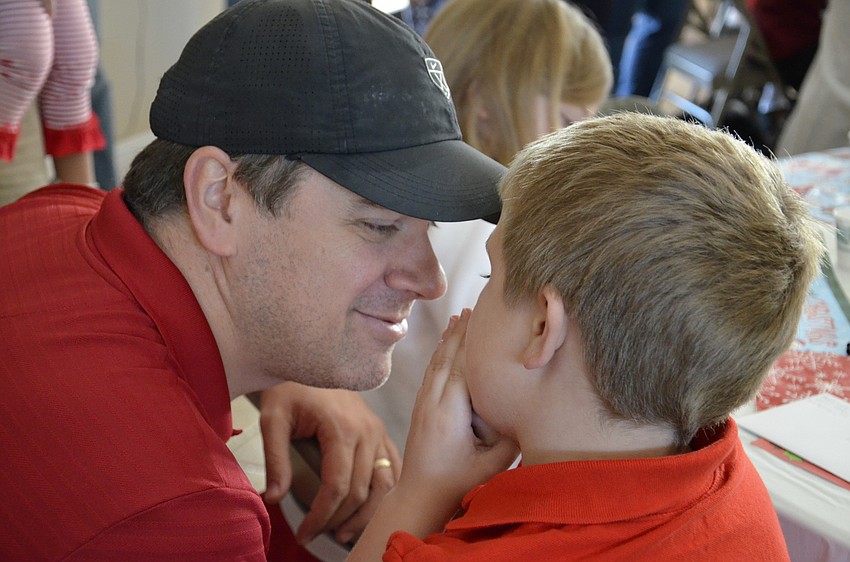 Will Hodges talks with his son, Beckham.