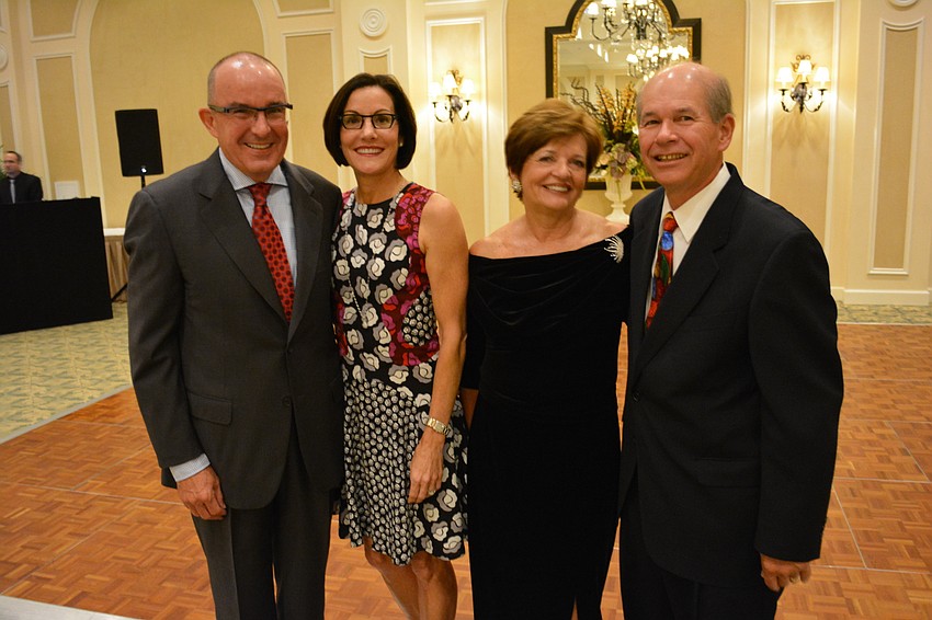 Greg Anderson, Sarah Anderson, Arta Burkhart and Ken Burkhart were getting ready for a little dancing at the Holiday Dinner Dance.