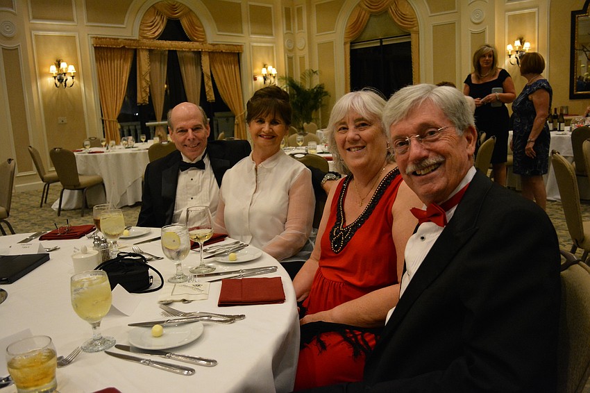 Fred Cimini and Marilyn Cimini join John Kerwin and Valerie Kerwin for a little fun before dinner is served at the Holiday Dinner Dance.