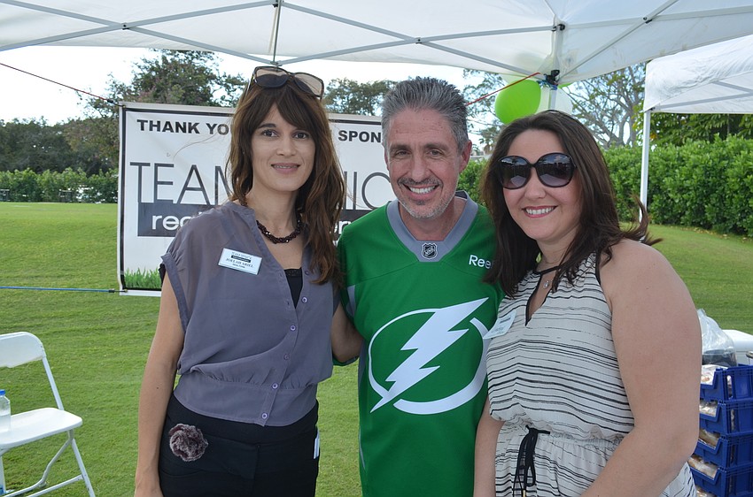 Joelah Ariel, of platinum sponsor Team Renick, event chairman Michael Garey and Lindsey Asfur, of Team Renick