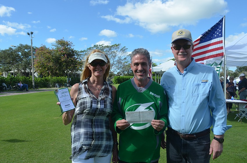 Susan Phillips, event chairman Michael Garey and Steve Branham