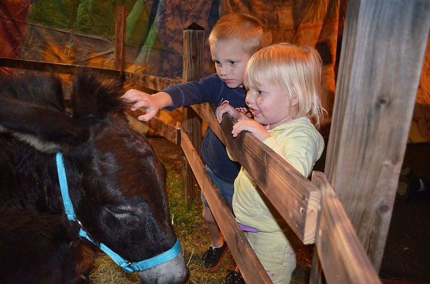 Logan and Gracie Walling, of Bradenton, make new friends.