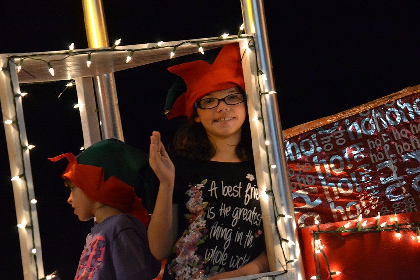 Children and families aboard the AROX Santa Claus float.