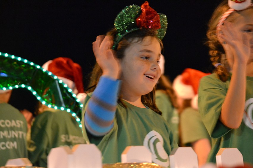 Suncoast Community Church members wave to the crowd.