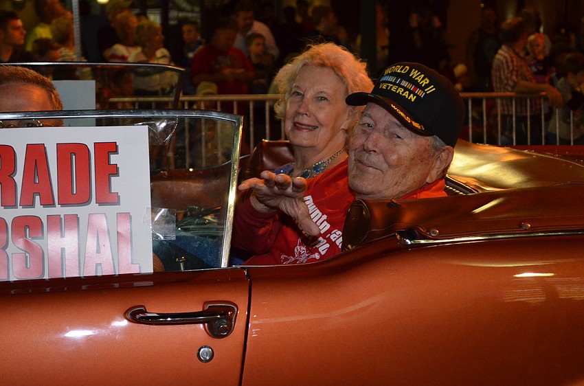 Parade Marshal Paul Thorpe rides along at the end of the parade.