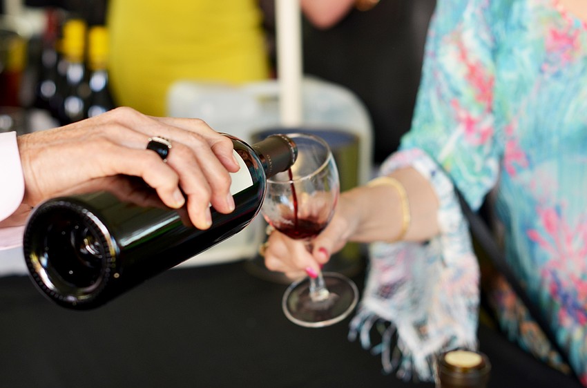 Guests enjoy sampling of wines at the Florida Winefest and Auction Bayfront Showcase Lunch Tasting.