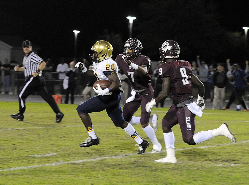 Braden River defensive backs Demetrius Lawson and JoJo Louis chase down St. Thomas Aquinas sophomore Benjamin Sapp III.