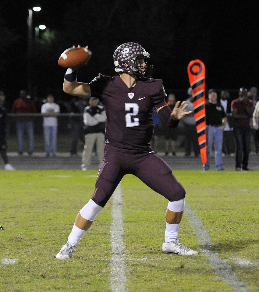 Braden River senior quarterback Jacob Huesman drops back for a pass in the first half.