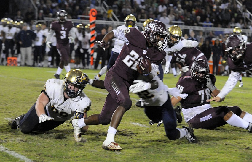 Braden River running back Dexter Hodo carries the ball for a first down.