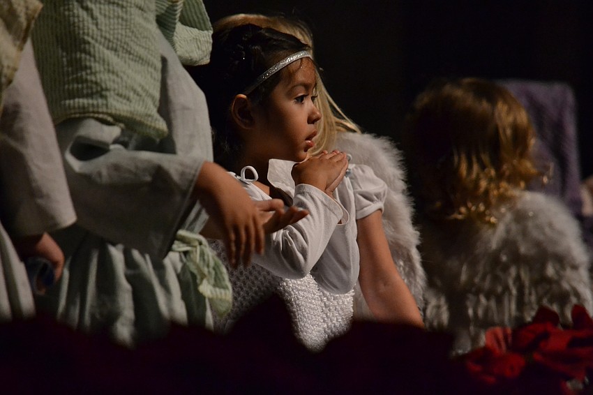 Children dressed as angels, the three wise men, Joseph and Mary during the performance.