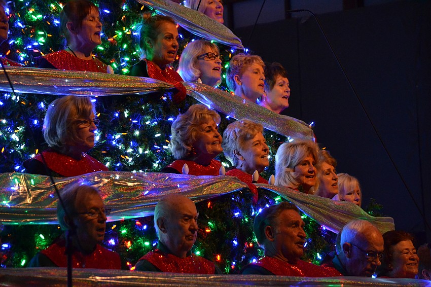 Eighty members in total are nestled into the tree for the performance.