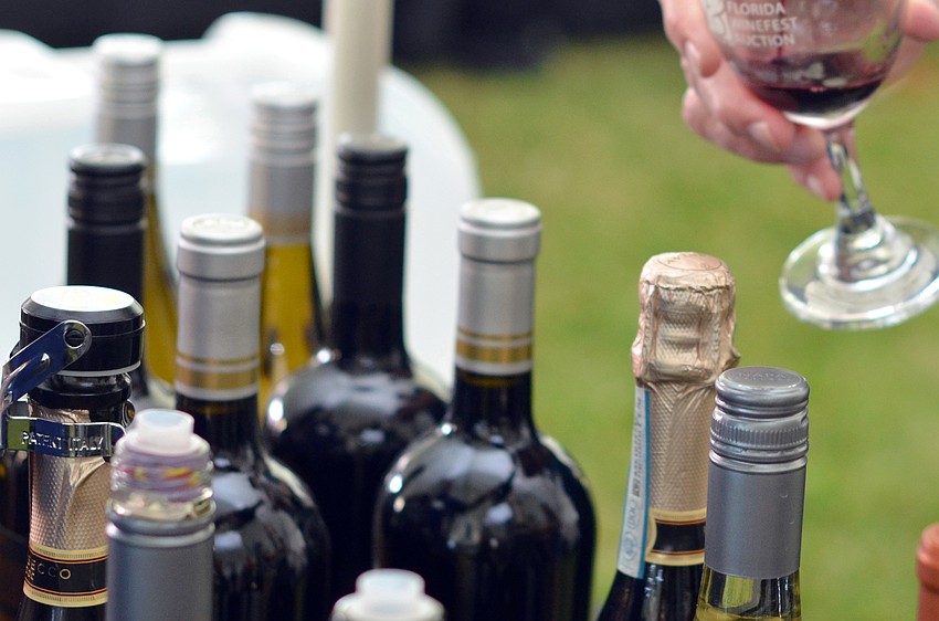 Guests enjoy sampling of wines at the Florida Winefest and Auction Bayfront Showcase Lunch Tasting.