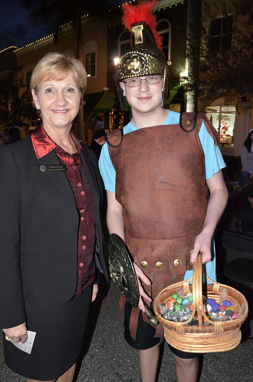 Vanessa Baugh with Daniel Braunstein, who dressed up as Judah the Maccabee and handed out gelt (chocolate coins)