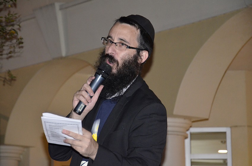 Rabbi Mendy Bukiet sings a blessing.