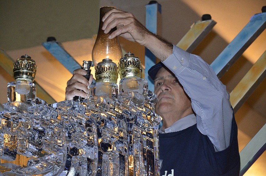 Steve Shapiro lights the menorah.