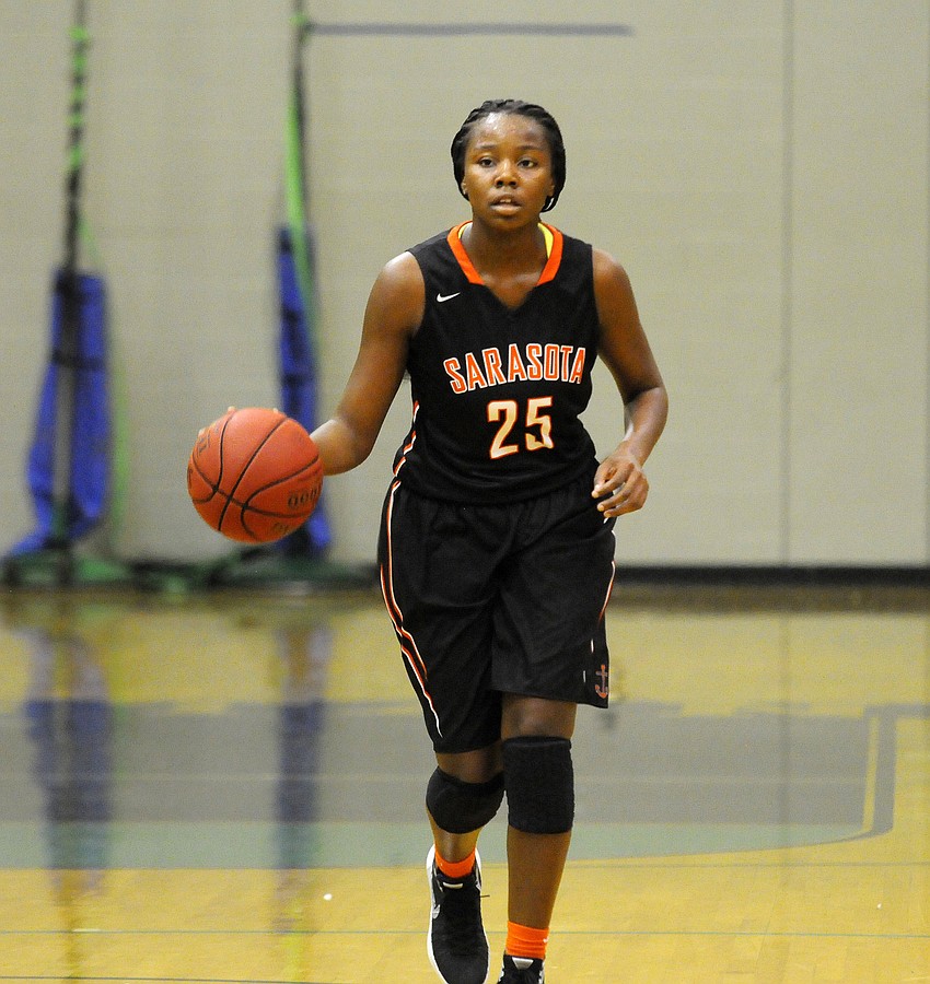 Sarasota junior Ja'da Bennett brings the ball down the court for the Sailors.