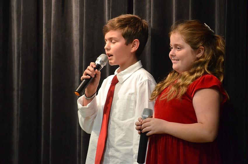 Tye Moore and Tiffany Anderson, of Bradenton, sing, 
