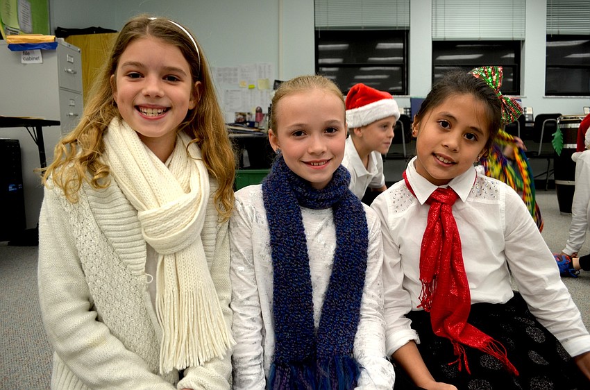 Kelsey Wilson, Lauren Costello and Brianna Ngo, of Bradenton, wait to go on stage.
