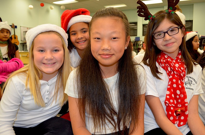 Kenna Myers, Janissa Shannon, Michelle Li and Ellianna Salazar, of Bradenton, show off their Christmas outfits.