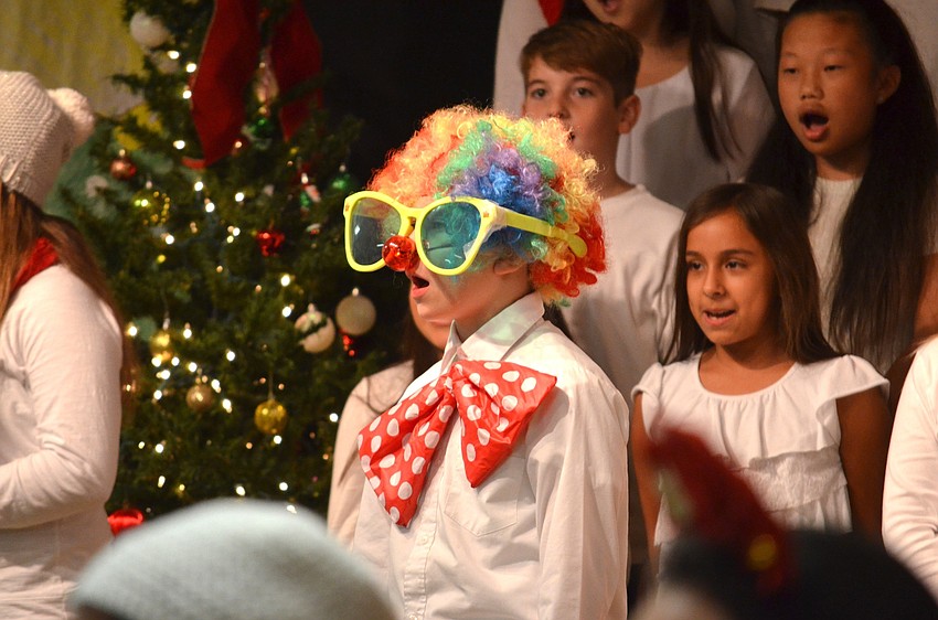 Seth Pisani, of Bradenton, clowns around on stage.